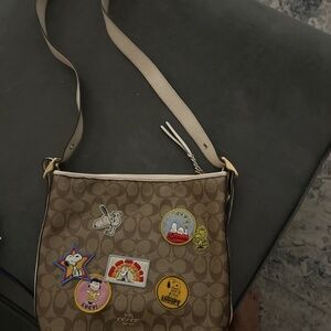 Coach peanuts patched back